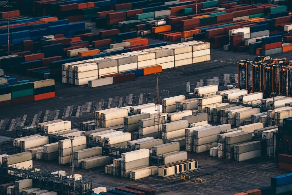 Shipping containers stacked at an industrial port