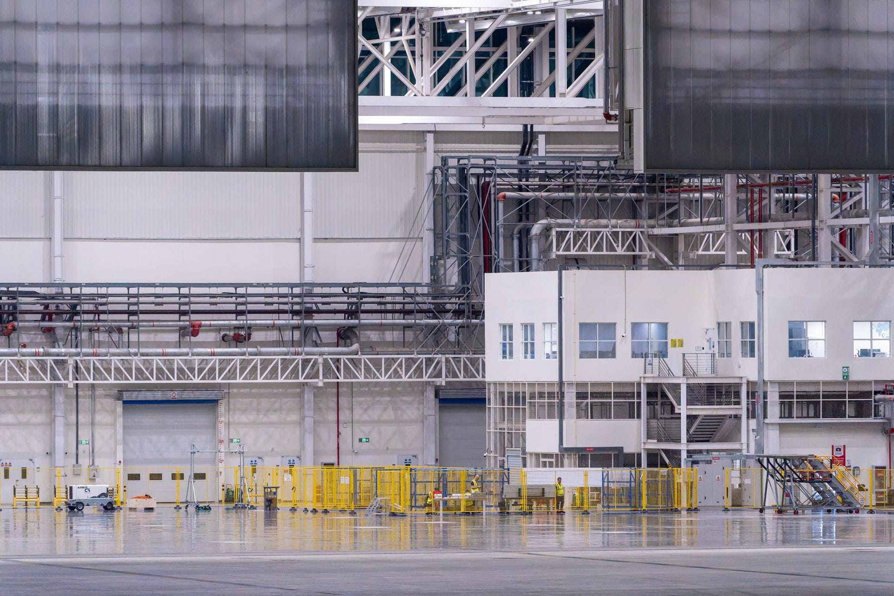 Modern factory interior with production equipment and a clean concrete floor