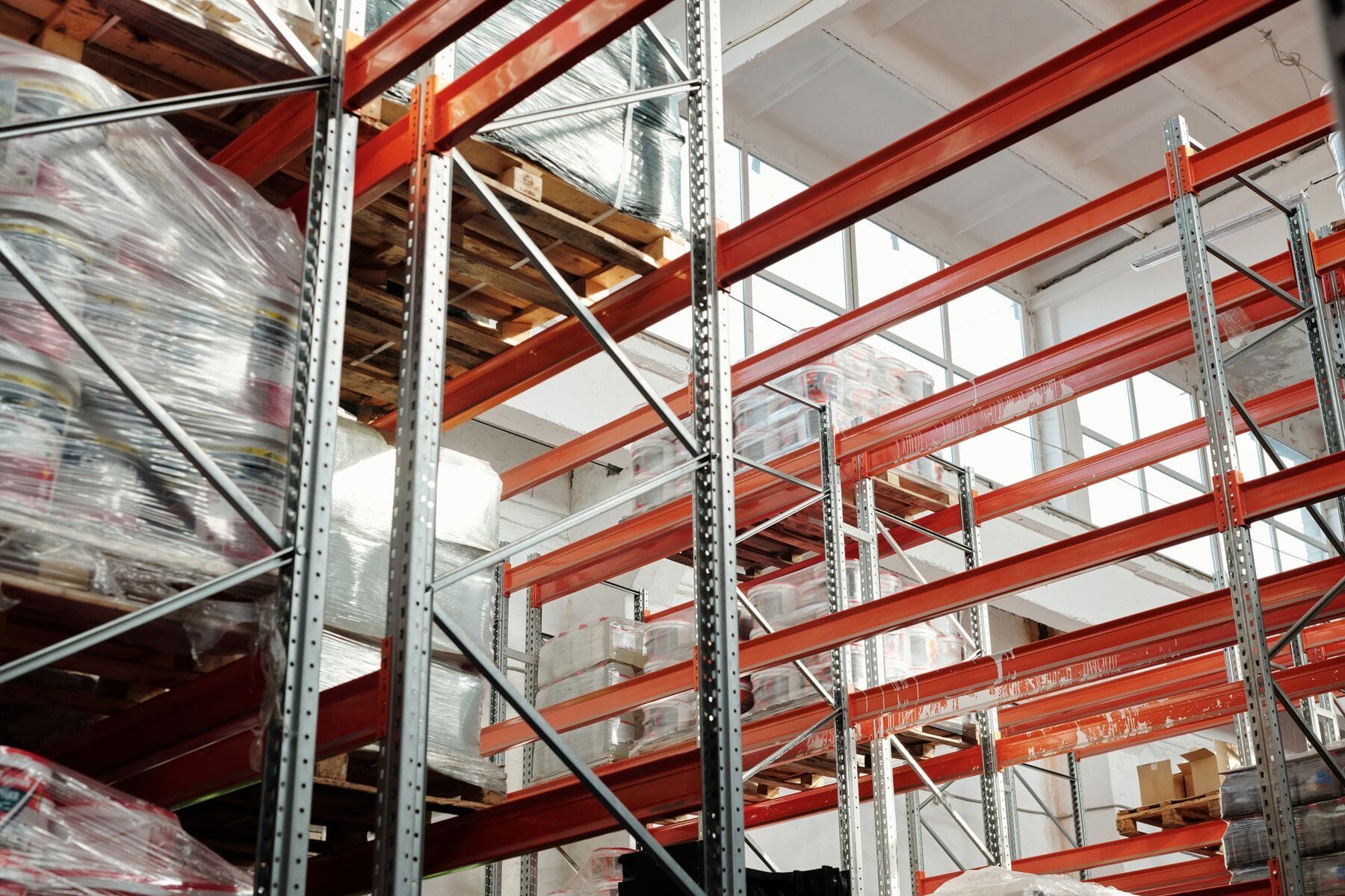 Bright warehouse interior with pallet racking and stored inventory