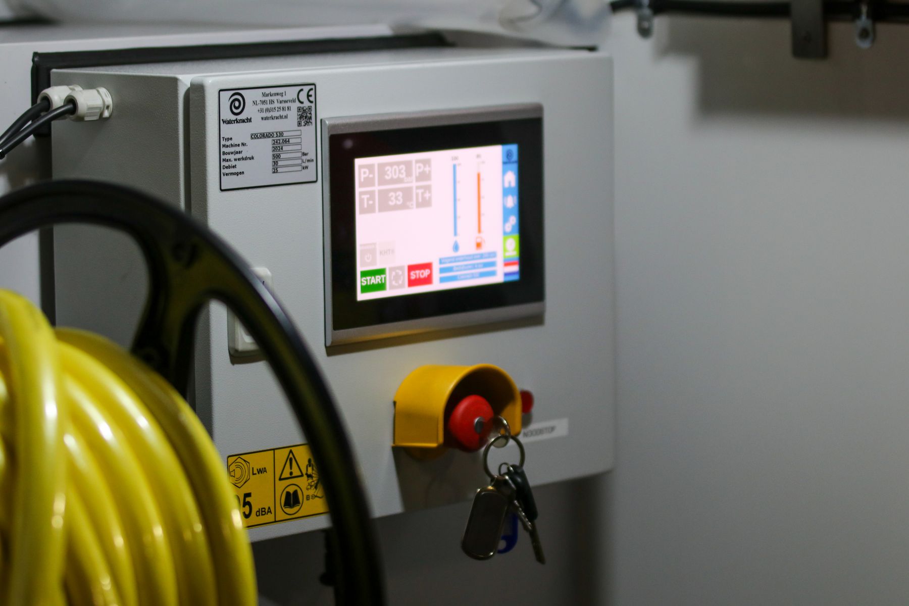 Industrial control panel with a digital screen and safety switch