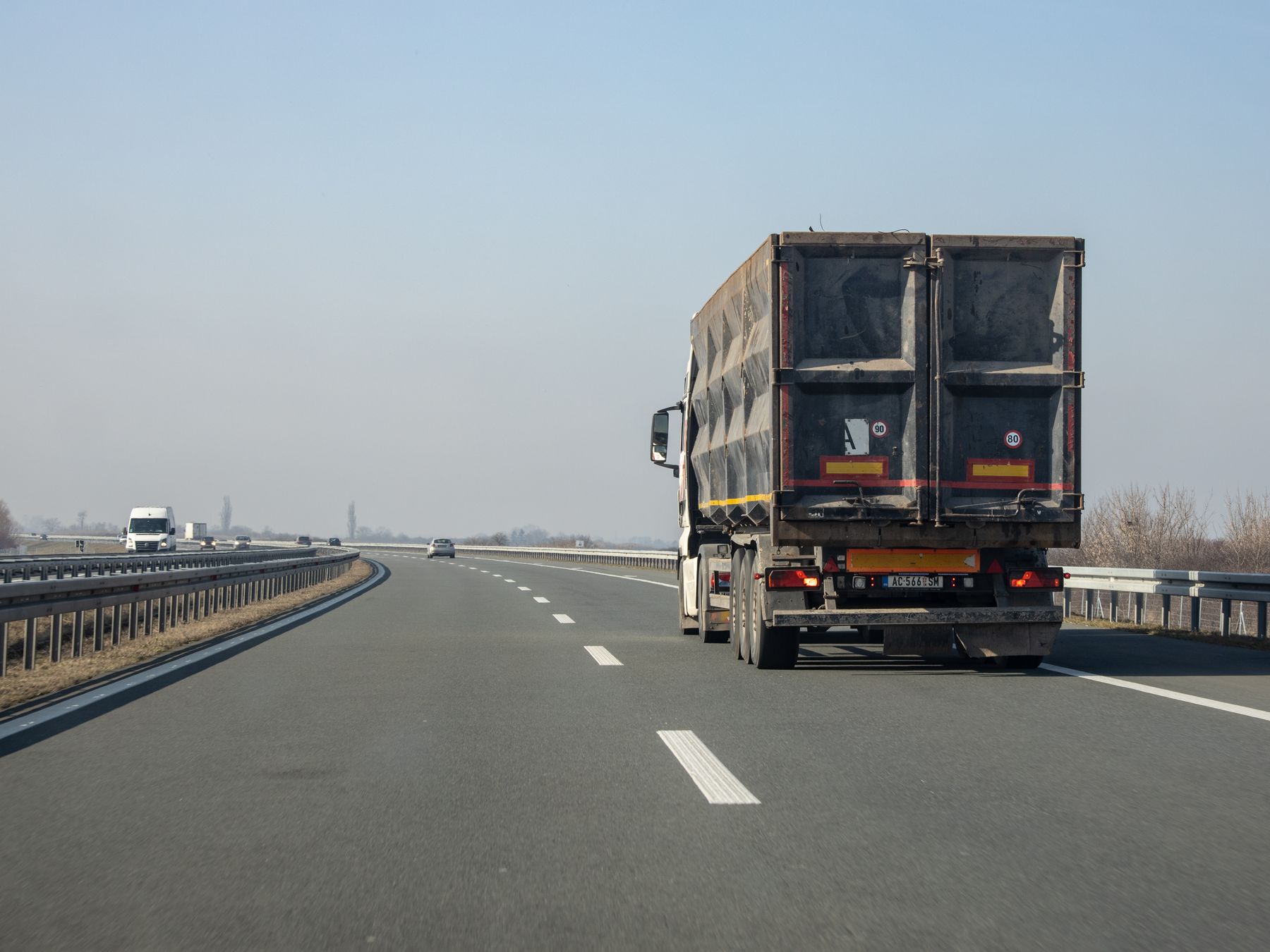 Rear view of a trailer travelling on a divided highway
